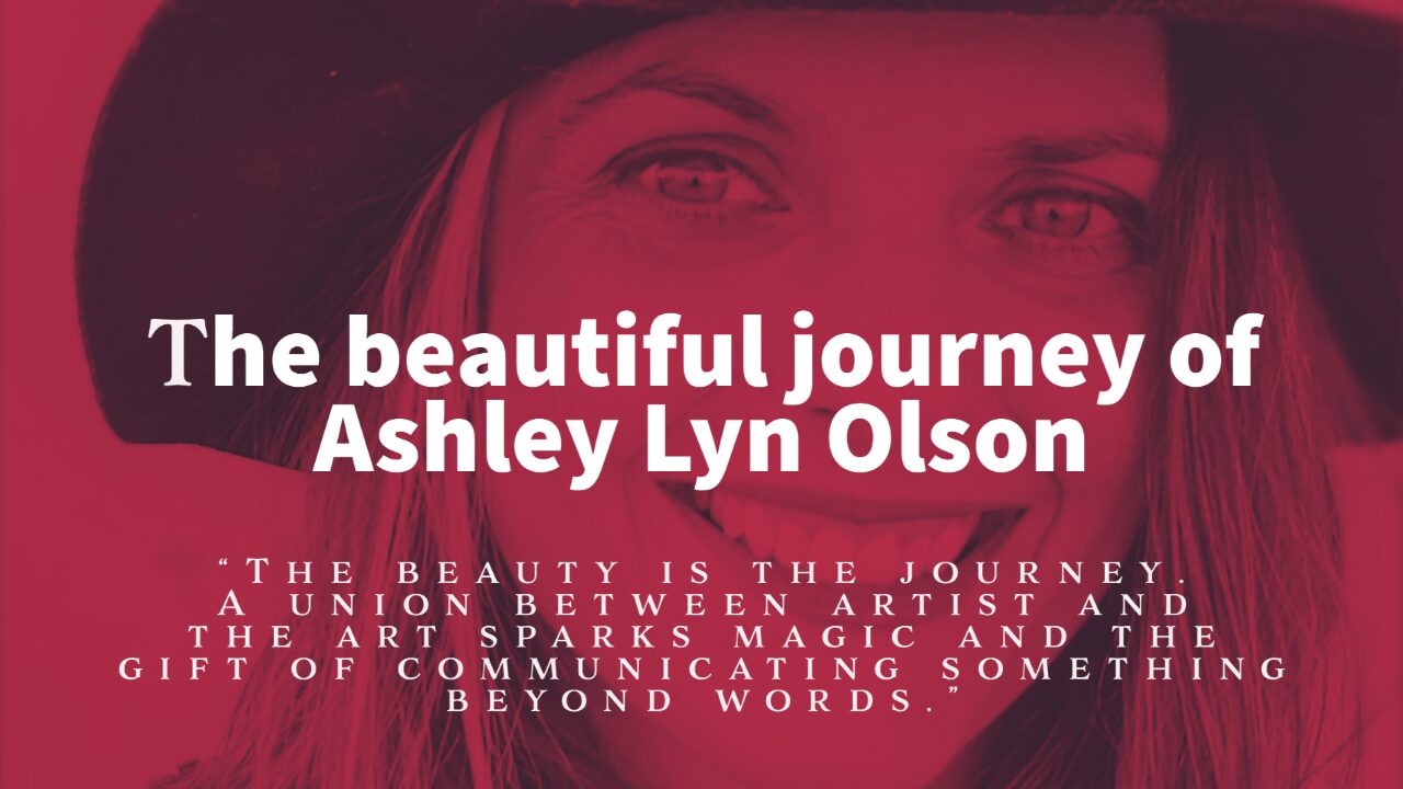 Ashley Lyn Olson wears a hat and smiles as she poses for the camera.