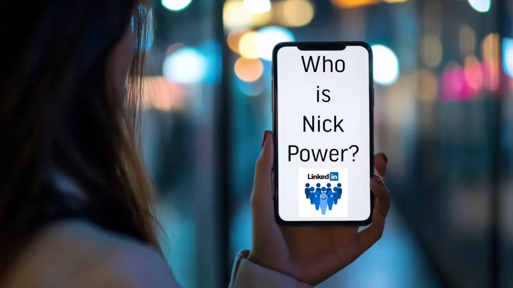 A woman holds her cell phone. On the screen are the words "who is Nick Power" and the LinkedIn logo.