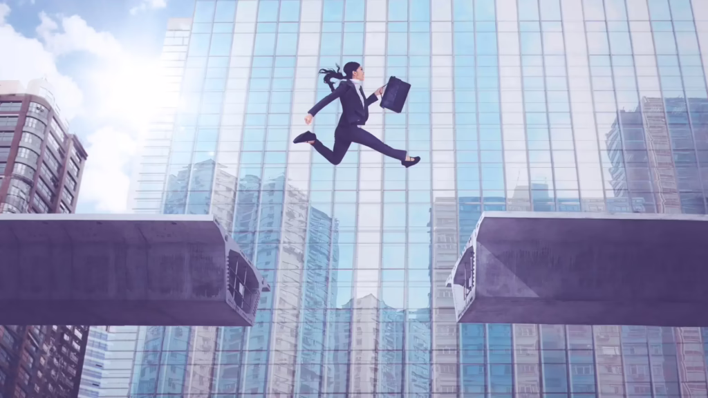 A business woman holds a briefcase and leaps over a gap in two steel beams 